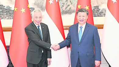 Photo of 习近平晤李显龙 吁共同抵制集团对立