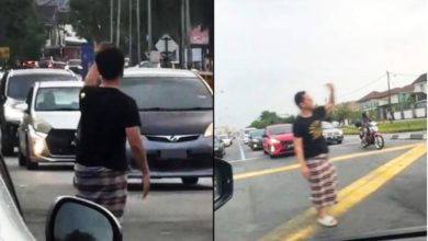 Photo of 挺身疏导免塞车 交通灯失灵纱笼男救场