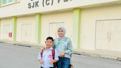 Photo of 马来少妇以中文助小贩 卖榴梿给中国客