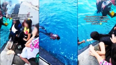Photo of 女游客遇巨浪手机掉海里 男员工2度冒险潜水捡回