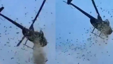 Photo of 2.1万钞票雨从天而降 街头奇观背后充满爱