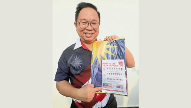 Photo of 梁德志：商家忧错挂 派说明书教正确挂国旗